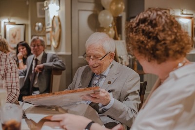 image of eldercelebrating with family
